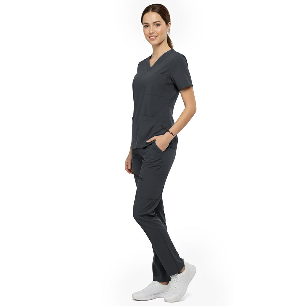 Side view of model using deep cargo pocket on Gray scrub pants, showing spacious storage for tools