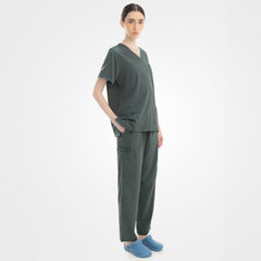 Side profile of Caribbean blue scrubs demonstrating 4-way stretch mobility