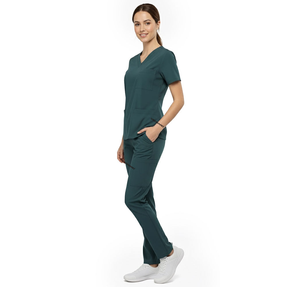 Side view of model using deep cargo pocket on Turquoise scrub pants, showing spacious storage for tools