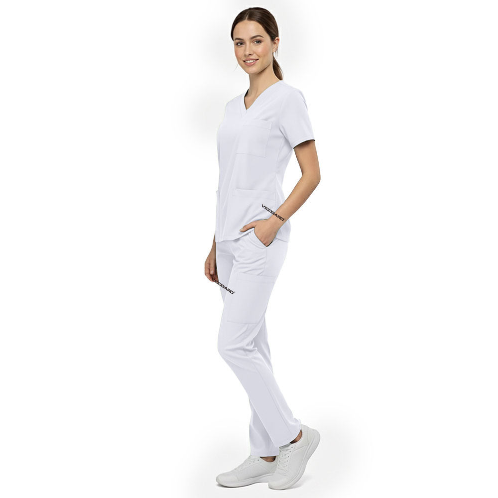 Side view of model using deep cargo pocket on White scrub pants, showing spacious storage for clinical tools