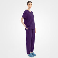Side profile of grape purple scrubs demonstrating 4-way stretch fit