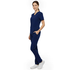 Side view of model using deep cargo pocket on Galaxy Blue scrub pants, showing spacious storage for tools