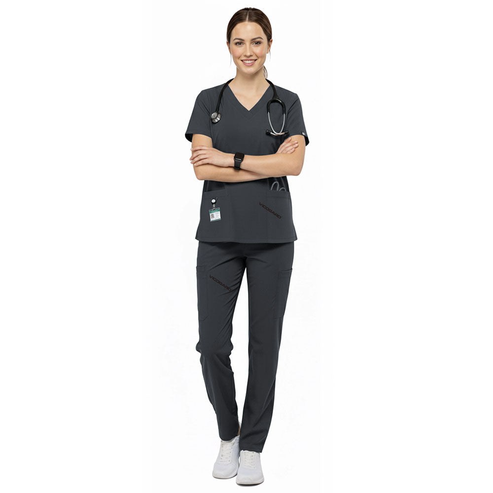 Medical professional wearing Gray performance scrubs ready for clinic administration duties