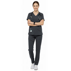 Medical professional wearing Gray performance scrubs ready for clinic administration duties
