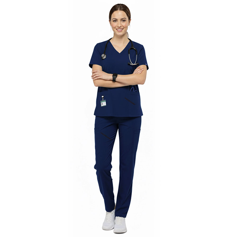 Medical professional wearing Galaxy Blue performance scrubs ready for clinic administration duties