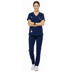 Medical professional wearing Galaxy Blue performance scrubs ready for clinic administration duties