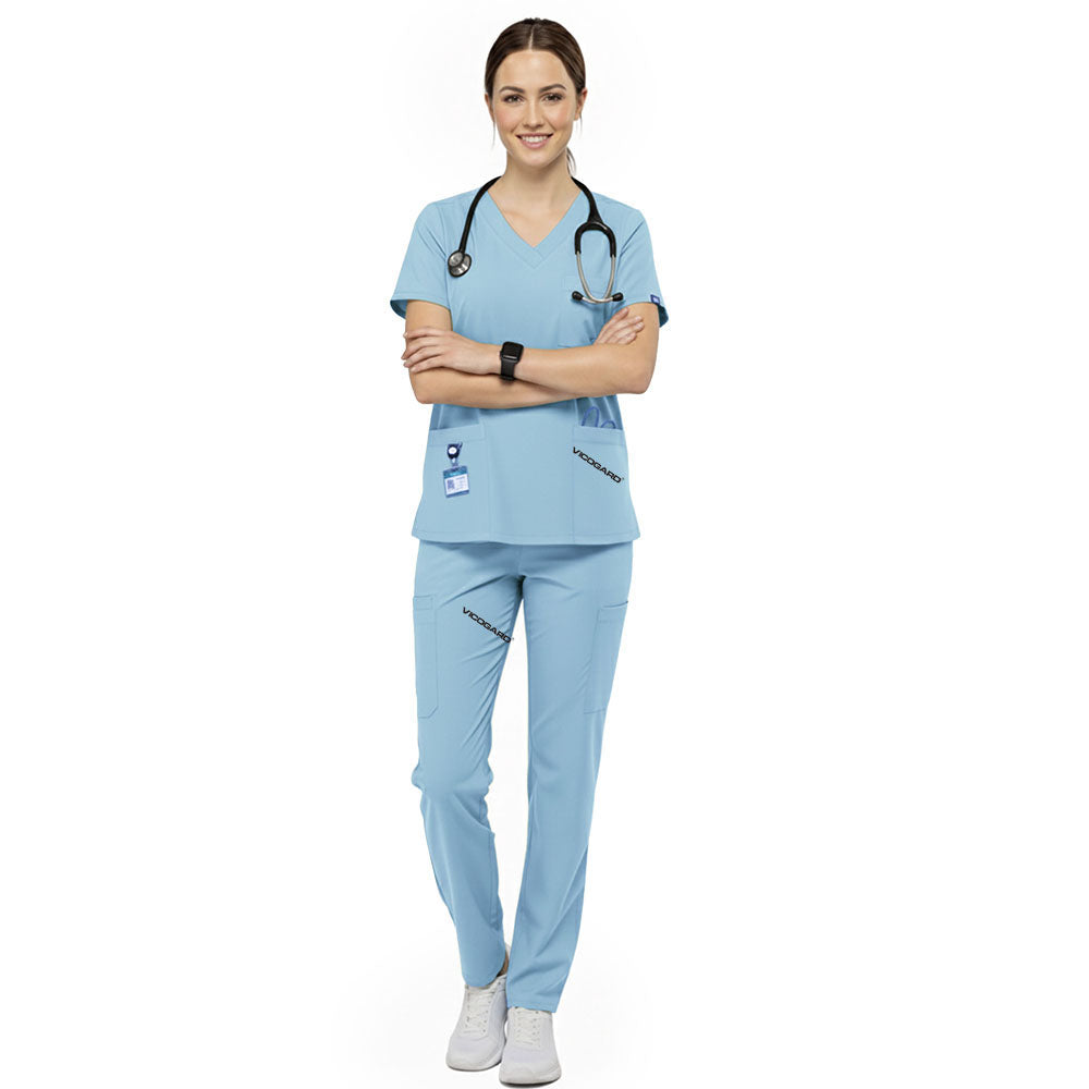 Radiology technician wearing Marine Blue performance scrubs ready for patient imaging