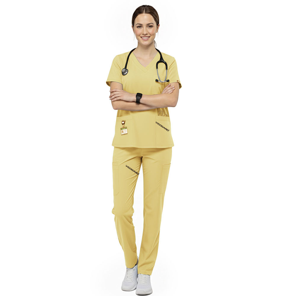 Pediatric nurse wearing Cream Yellow performance scrubs ready to comfort young patients