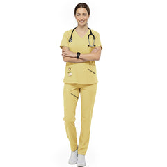 Pediatric nurse wearing Cream Yellow performance scrubs ready to comfort young patients