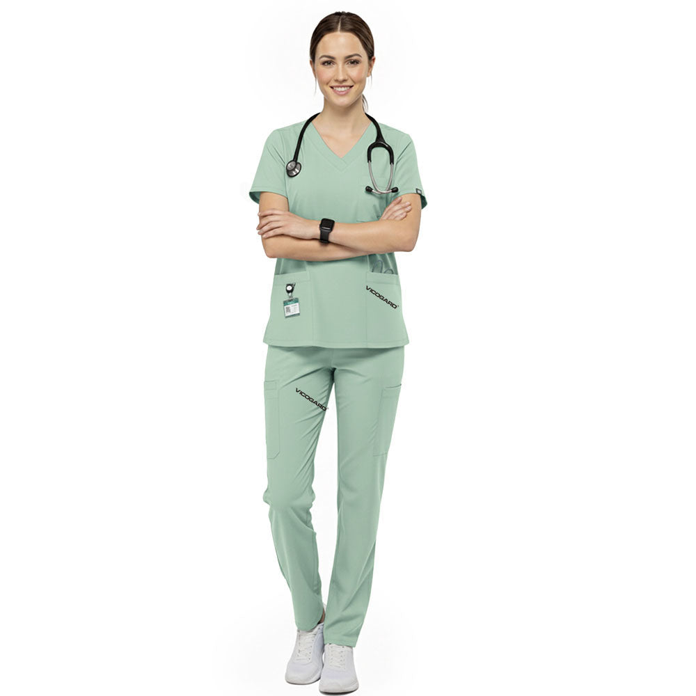 Veterinary technician wearing Avocado Green performance scrubs ready for animal care