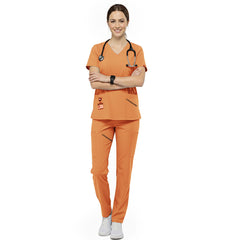 Emergency nurse wearing Orange performance scrubs ready for fast-paced patient care