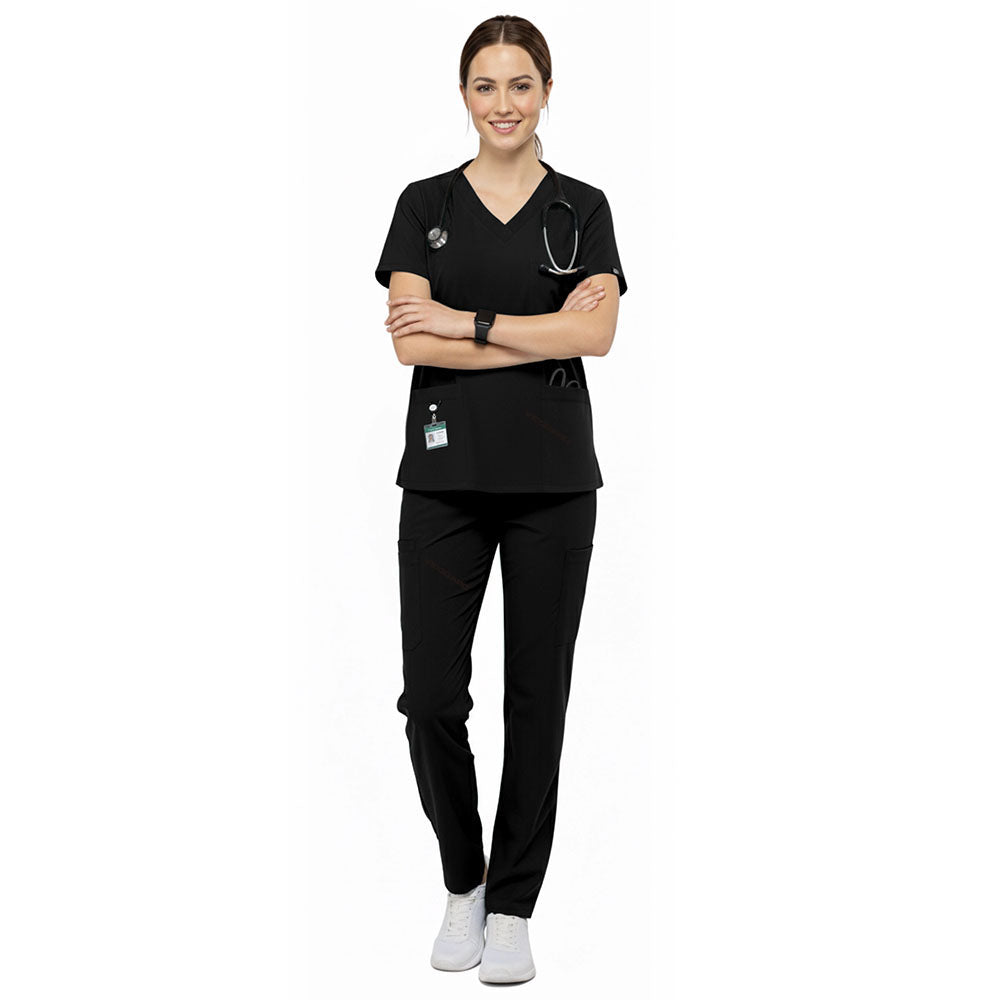 Esthetician wearing Black performance scrubs ready for client consultation in med spa