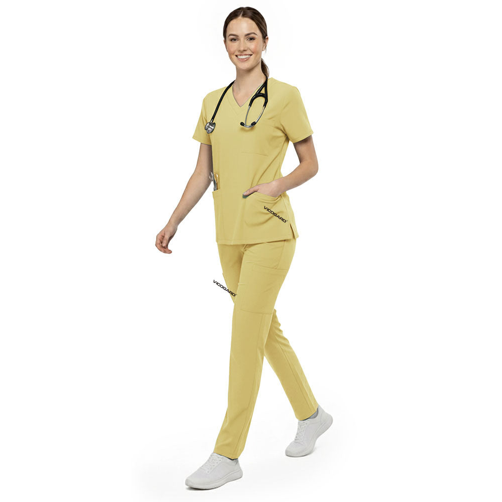 Vet tech reaching into chest pocket of Cream Yellow V-neck scrub top, demonstrating easy access