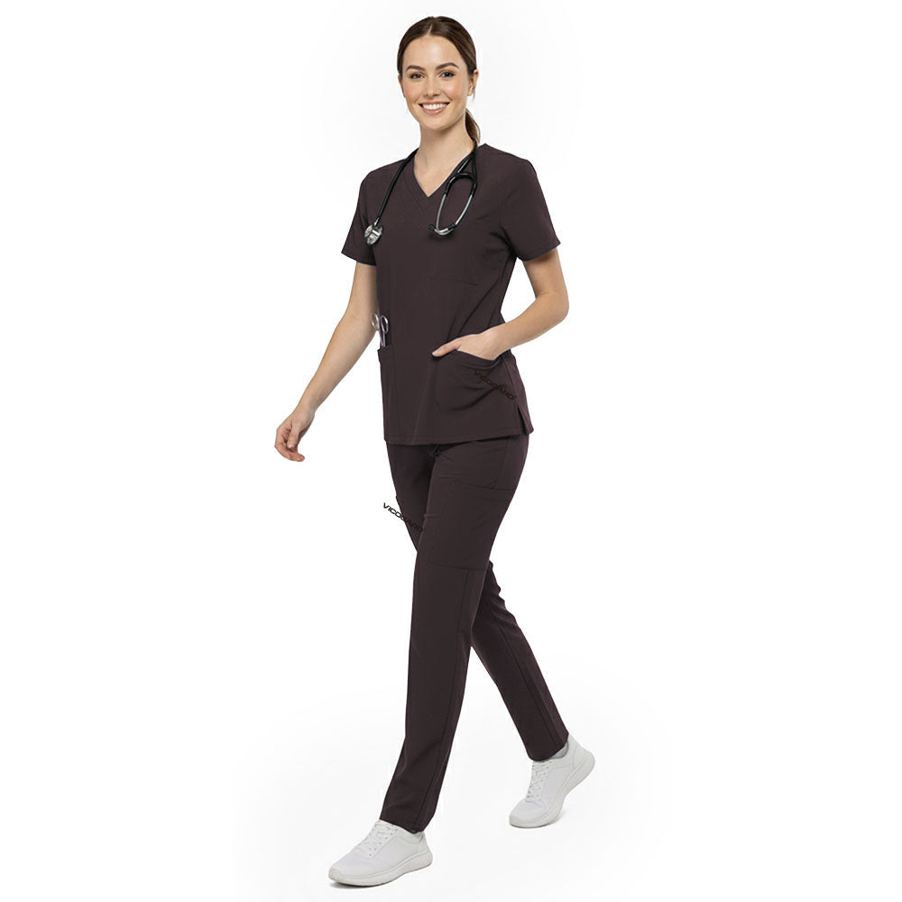 Professional reaching into chest pocket of Chocolate V-neck scrub top, demonstrating easy access