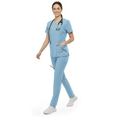 Nurse reaching into chest pocket of Marine Blue V-neck scrub top, demonstrating easy access