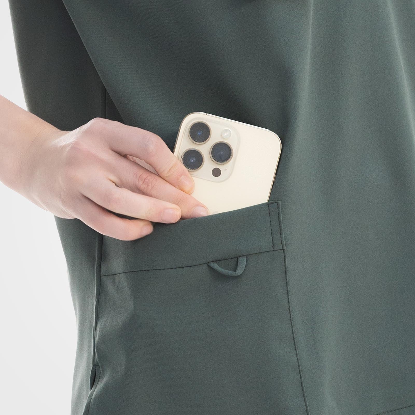 Double layer cargo pocket detail on teal straight leg scrub pants