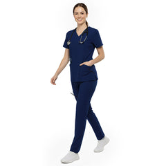 Nurse reaching into chest pocket of Galaxy Blue V-neck scrub top, demonstrating easy access to pens