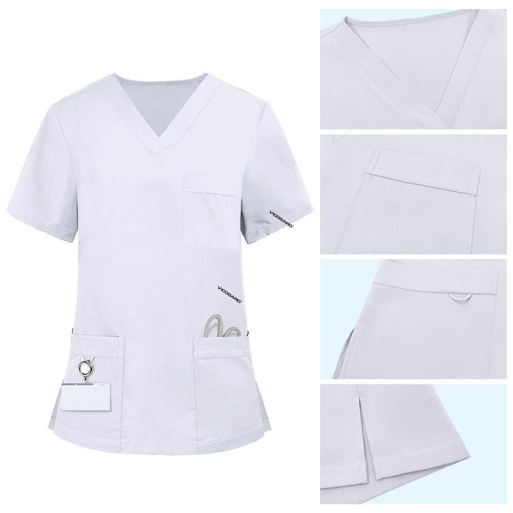 Detail of White scrub top pocket with functional bungee loop for hanging ID badges or keys