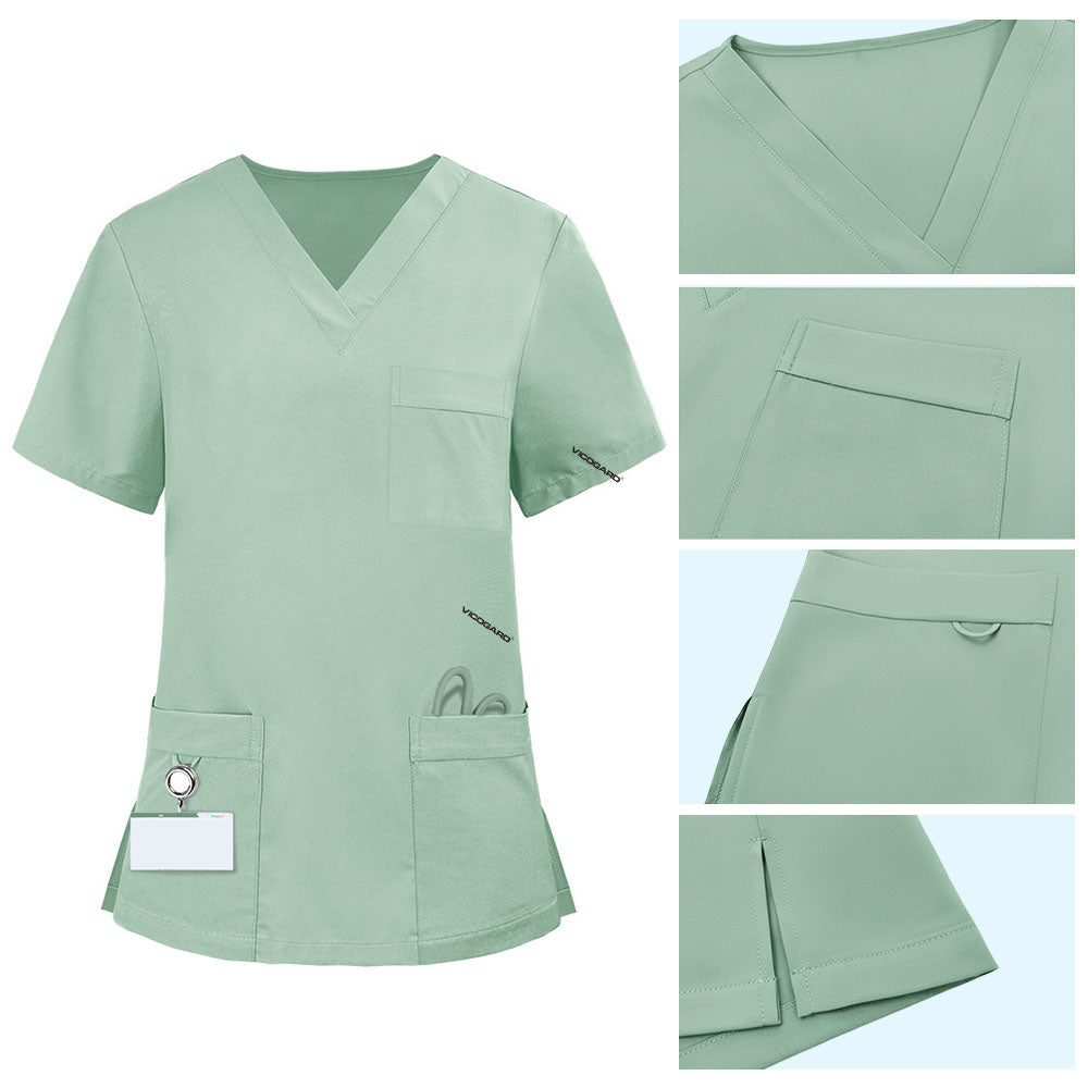 Detail of Avocado Green scrub top pocket with functional bungee loop for hanging clickers or IDs