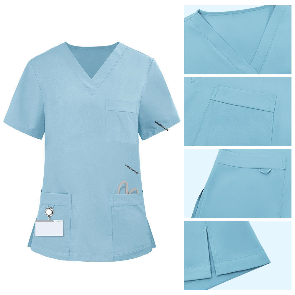 Detail of Marine Blue scrub top pocket with functional bungee loop for hanging ID badges