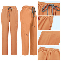 Detail of Orange straight leg pants showing elastic waistband and multi-pocket cargo design