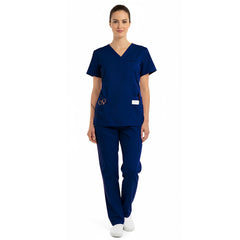 Front view of model in the classic vicogard Pro Custom Unisex Scrub Set in Navy