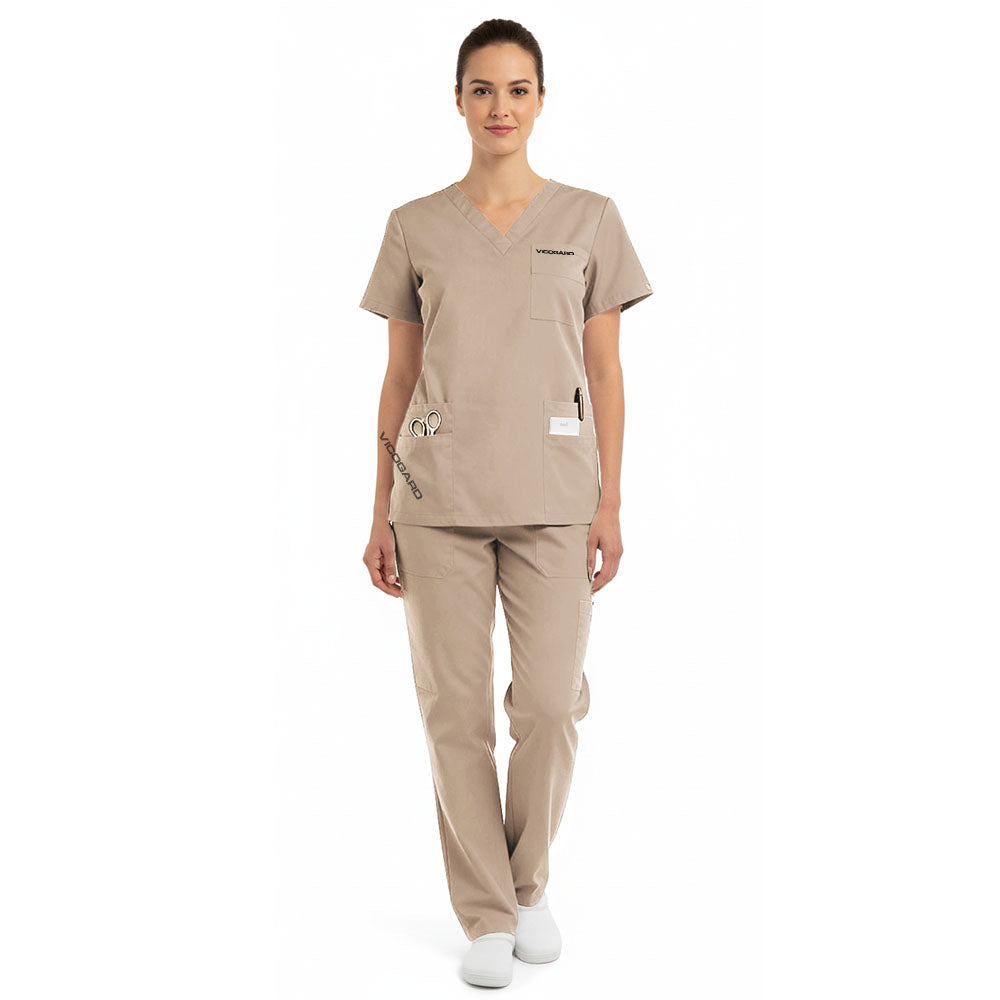 Model wearing the modern vicogard Pro Custom Unisex Scrub Set in Sand