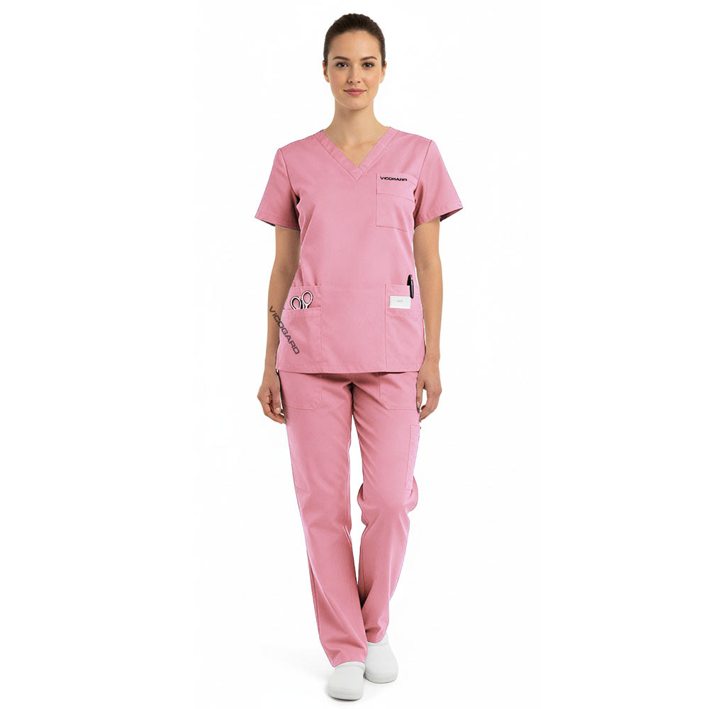 Full body view of model in vicogard Pro Custom Unisex Blush Pink scrub set