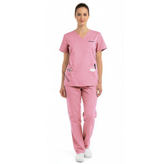 Full body view of model in vicogard Pro Custom Unisex Blush Pink scrub set