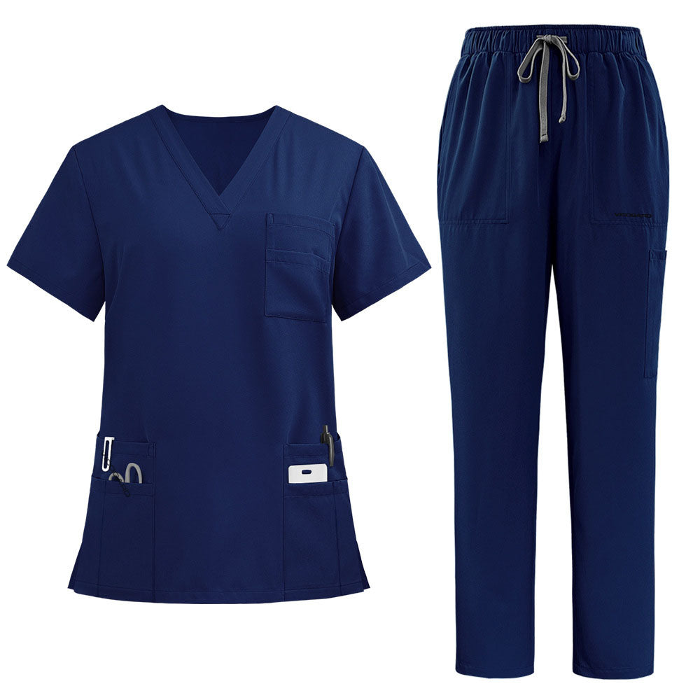The complete vicogard Pro Custom scrub set in timeless Navy blue, laid flat