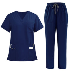 The complete vicogard Pro Custom scrub set in timeless Navy blue, laid flat