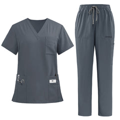 vicogard Pro Custom unisex scrub set in Heather Gray, arranged on a flat surface