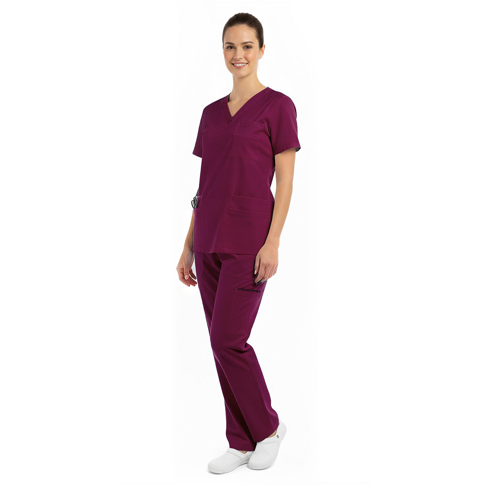 Side view of the Burgundy Pro scrub set on a model, highlighting the silhouette