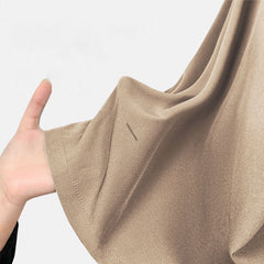 Texture shot of the 4-way stretch fabric in the calming Sand color