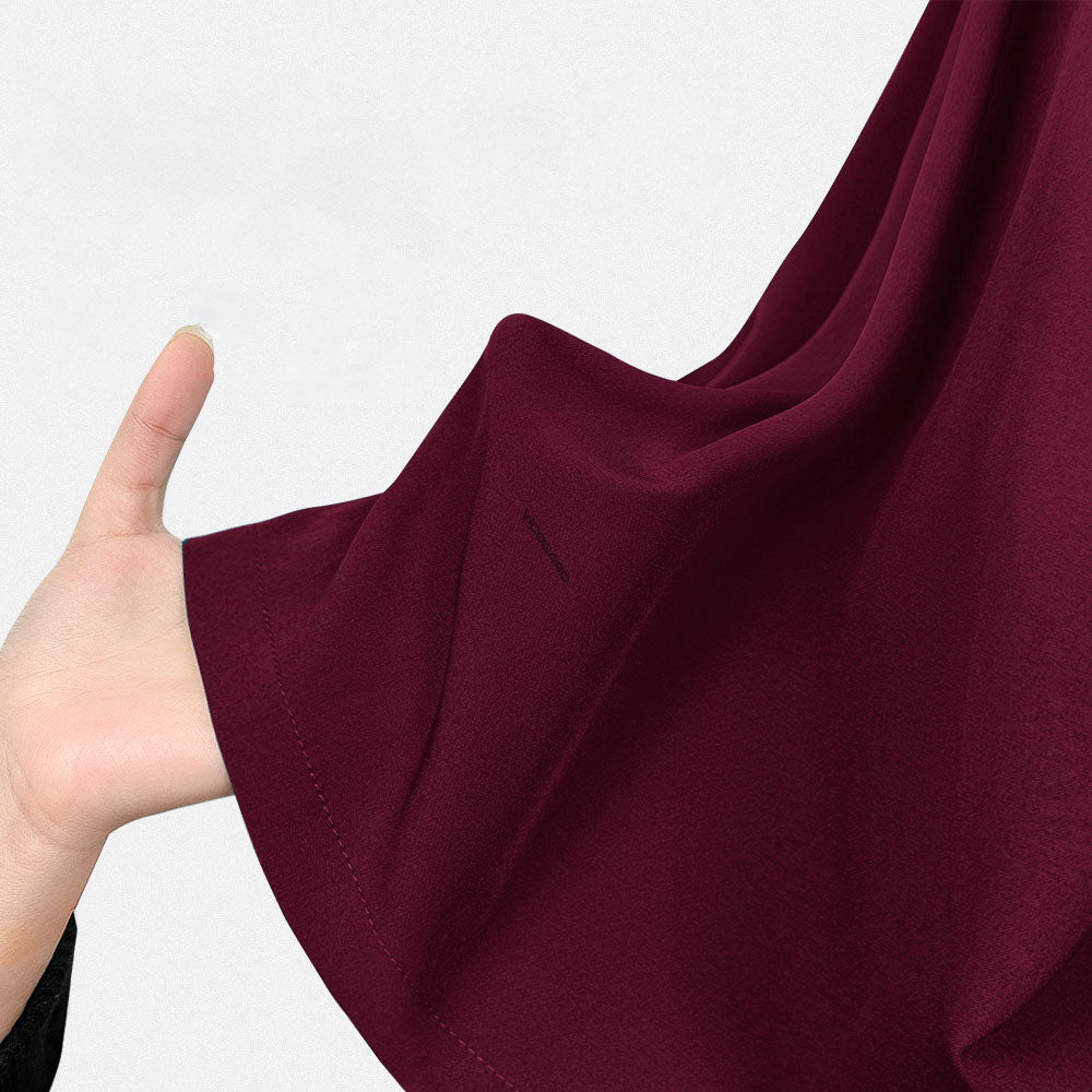 Close-up showcasing the rich color and texture of the Burgundy 4-way stretch fabric