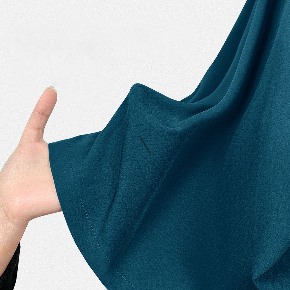 Close-up of the 4-way stretch fabric in tropical Caribbean Blue
