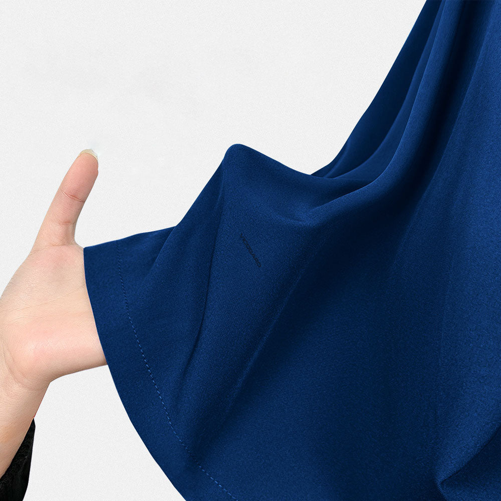 Close-up of the durable, 4-way stretch Navy fabric, showing its deep color