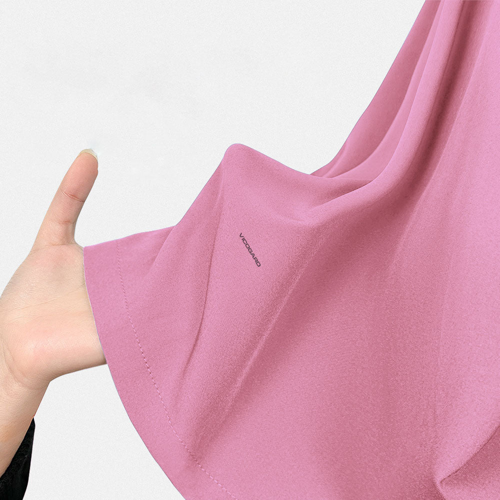 Close-up of the soft-touch, 4-way stretch Blush Pink scrub material