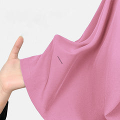 Close-up of the soft-touch, 4-way stretch Blush Pink scrub material