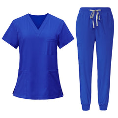 Flat lay of Royal Blue scrub set including V-neck top and jogger pants
