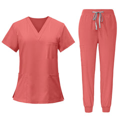 Flat lay of Orange Red scrub set featuring V-neck top and matching jogger pants