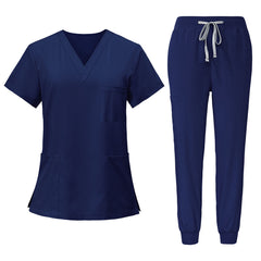 Flat lay of Navy Blue scrub set featuring V-neck top and jogger pants