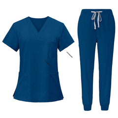 Flat lay of Caribbean Blue scrub set featuring V-neck top and jogger pants