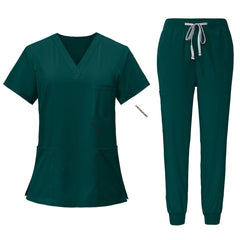 Flat lay of Hunter Green scrub set featuring V-neck top and jogger pants