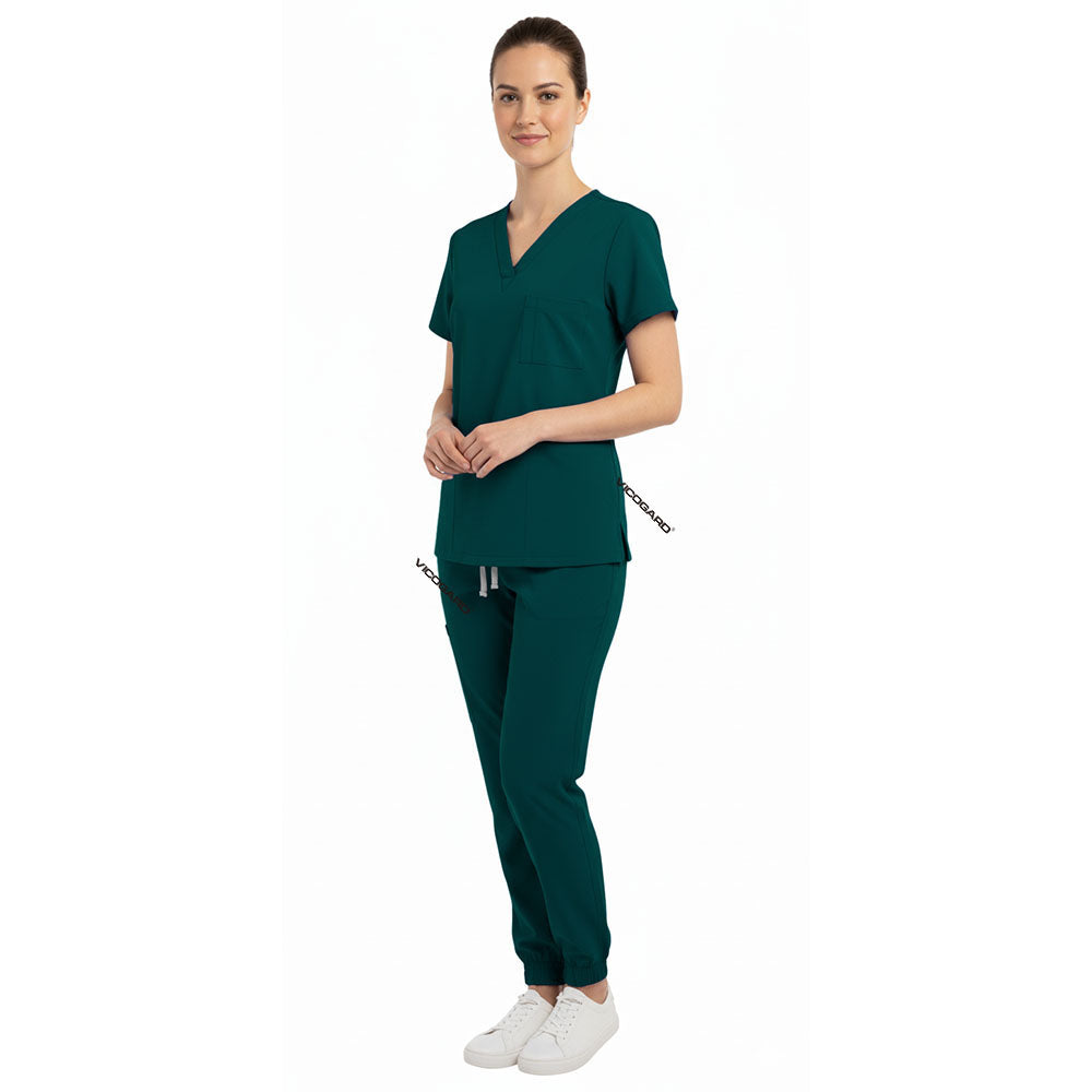 Side view of Hunter Green scrub joggers showing athletic fit and deep cargo pockets