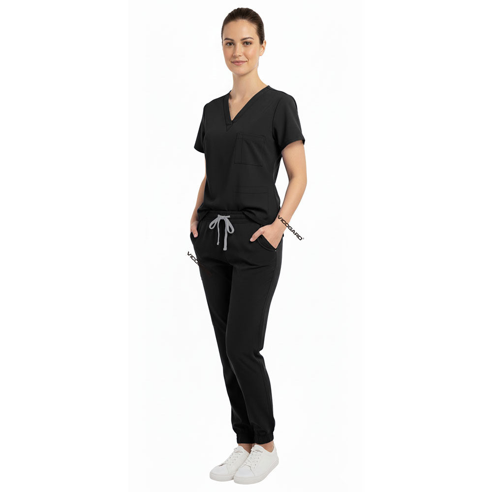 Medical professional utilizing spacious pockets on Vicogard Black stretch scrub pants