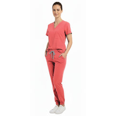 Medical professional using spacious pockets on Vicogard Orange Red stretch scrubs