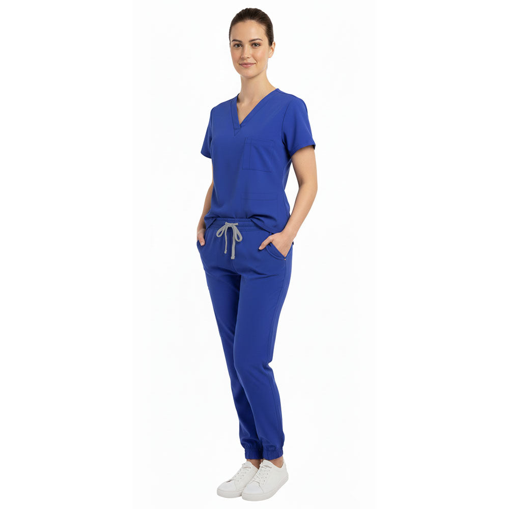 Nurse demonstrating functional pockets on Vicogard Royal Blue stretch scrubs