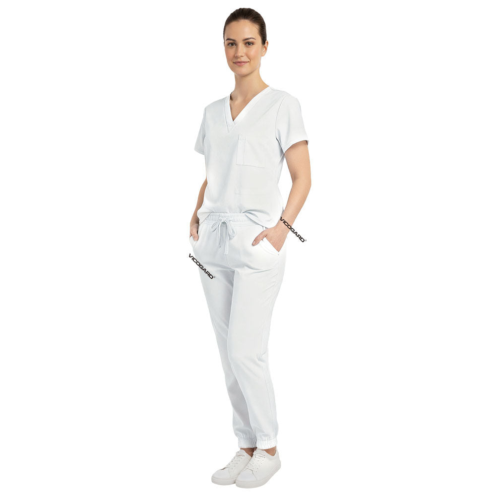 Medical professional utilizing functional pockets on Vicogard White stretch scrub pants