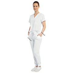 Medical professional utilizing functional pockets on Vicogard White stretch scrub pants